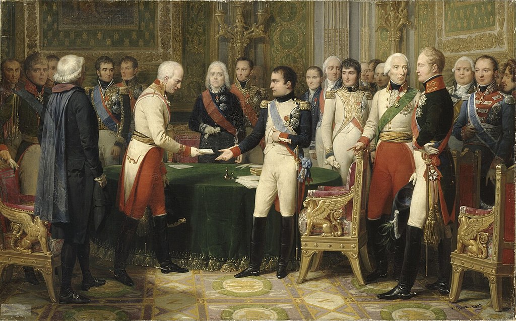 Une scène de banquet somptueux représentant la rencontre entre Napoléon et l'écrivain allemand Goethe. Les figures puissantes sondent les intentions l'une de l'autre, transcendant l'échange culturel simple. La cuisine devient un outil diplomatique crucial sur la scène politique et culturelle.